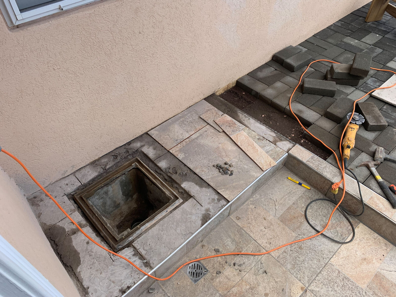 Drainage access integrated into paving